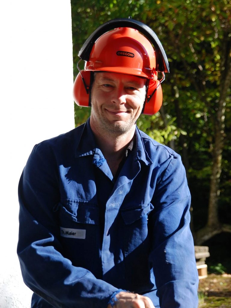 Thomas smiles as he dons his protective gear